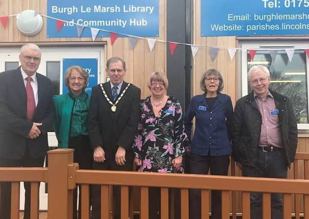 The official opening of the new Burgh Library and council offices with (from left) Jim Moss, library secretary, Lincolnshire author Margaret Dickinson, Burgh-le-Marsh Mayor Coun Neil Coo[er, Sue Elliff, volunteer, Julie Peach, chairman of the volunteer group, and Peter Dalby, volunteer. ANL-180416-161149001