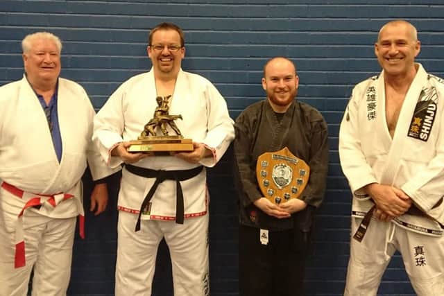 Recipients show off their awards.