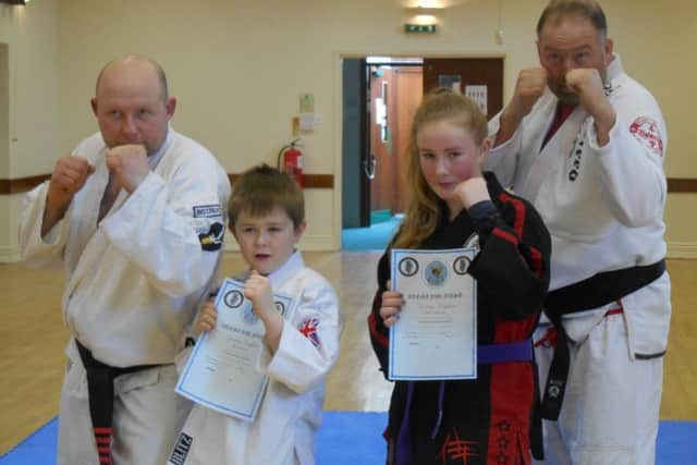 Riley Wainwright and Charity Quincey with Sensei Andrew Wainwright and Sensei Gordon Redford.