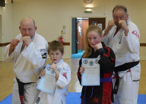 Riley Wainwright and Charity Quincey with Sensei Andrew Wainwright and Sensei Gordon Redford.