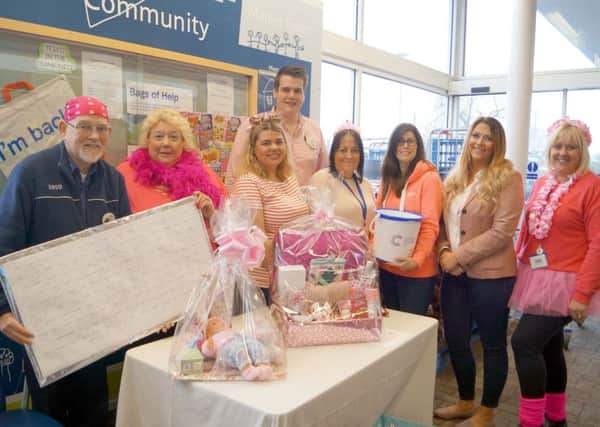 Tesco staff get in the pink for Cancer Research UK EMN-180415-190955001