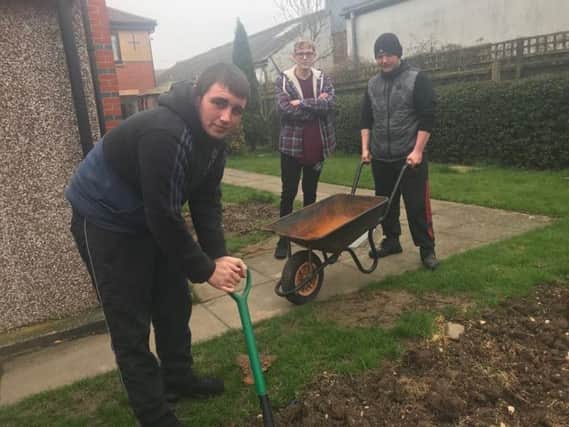 Residents working on the Hope project in the garden at Witham Lodge in Skegness. ANL-181204-155547001