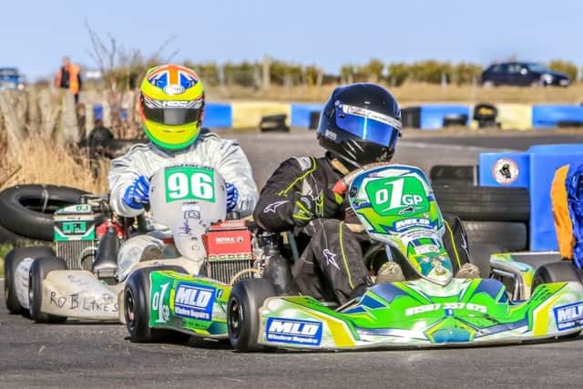 Dan Ireland (1) feels the heat from Newarks Milton Steele-Vaesson in the Max-177 race EMN-181204-163306002