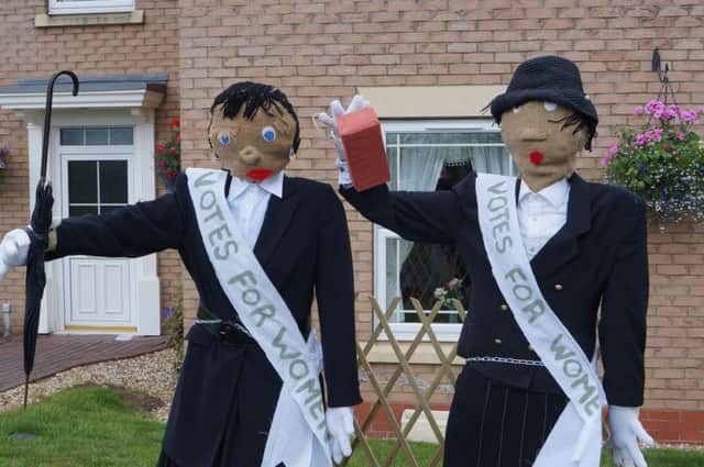 Two of ther scarecrows at a previous festival in Faldingworth EMN-180423-094324001