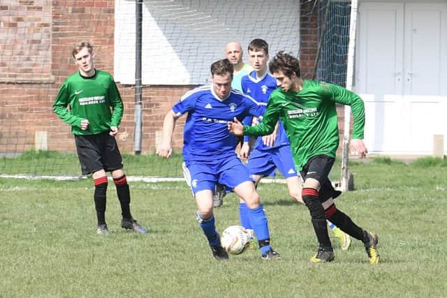 Fishtoft (blue) v Coningsby (green). Kev Parker (blue), Sean Boothby (green).