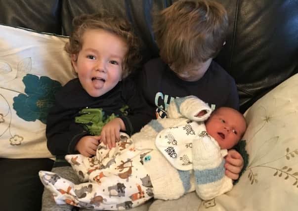 Harrison with his old brother Lennon, four, and five-month-old baby brother McCartney.