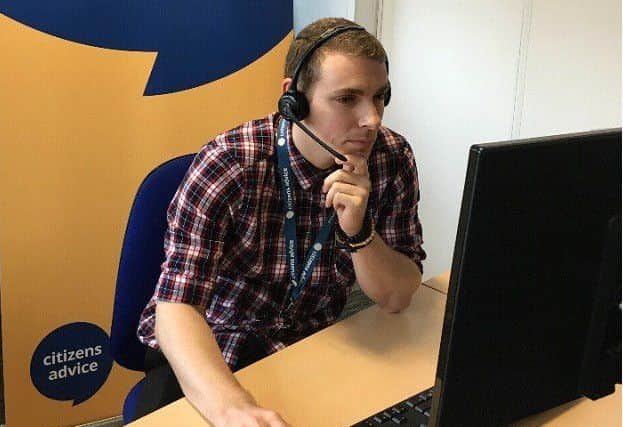 Helping hand: a volunteer at work in one of the Citizens Advice Lindsey offices EMN-180419-100232001