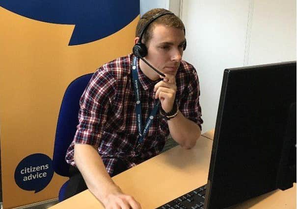 Helping hand: a volunteer at work in one of the Citizens Advice Lindsey offices EMN-180419-100232001