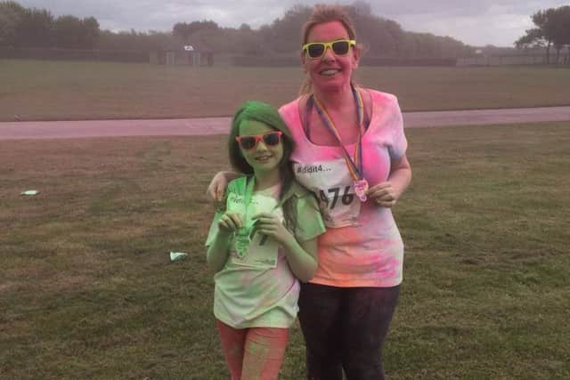 Emma Framingham and daughter Sienna at last year's colour dash for St Barnabas. EMN-180420-143110001