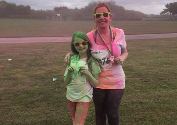 Emma Framingham and daughter Sienna at last year's colour dash for St Barnabas. EMN-180420-143110001