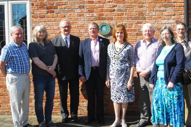 Sleaford and District Civic Trust members join Mayor of Sleaford Jan Mathieson for the unveiling of their new Sleaford Heritage Trail plaques. EMN-180420-170438001