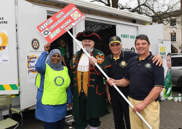 St George's Day market in Sleaford Market Place. L-R Shereen Ajumal, Sleaford Town Crier John Griffiths, Norry Bell, Alan Thomas. EMN-180423-101319001