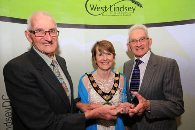 Chairman of the Council's Special Award presented by Coun Lawrence to winners David and Louis King. EMN-180424-110355001