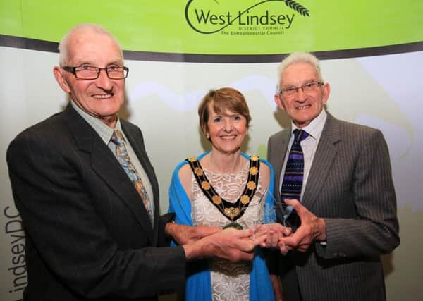 Chairman of the Council's Special Award presented by Coun Lawrence to winners David and Louis King. EMN-180424-110355001