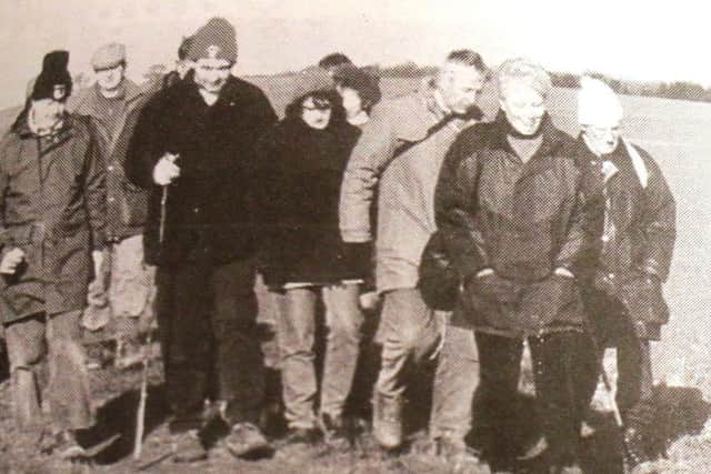 The walk covered seven and a half miles of guided time travel which looked back to those pre-glacial days when the sea lapped at the foot of the Wolds and woolly mammoths roamed free. Pictured are just some of the jolly walkers who were striding through the wolds at the time.