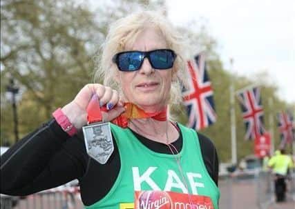 Science teacher Kath Wood with her London Marathon medal. Images supplied