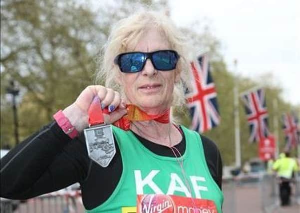 Science teacher Kath Wood with her London Marathon medal. Images supplied