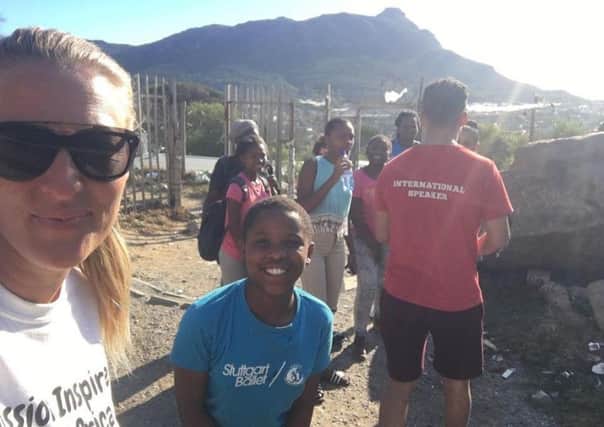 Emma Wilson visiting one of the youth projects in Capetown. EMN-180105-141357001