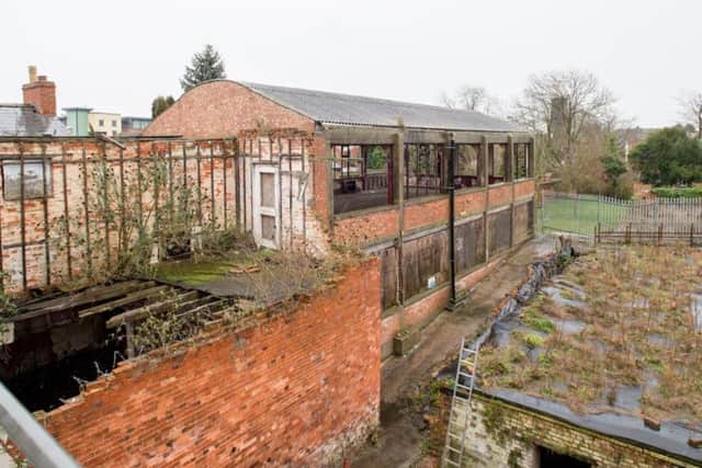 The land to the rear of the Market Place buildings earmarked for the Sleaford cinema project. EMN-180430-151754001