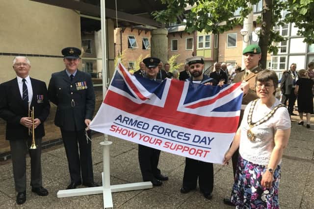 The flag raising ceremony that launched last year's Armed Forces Week. EMN-180425-142008001