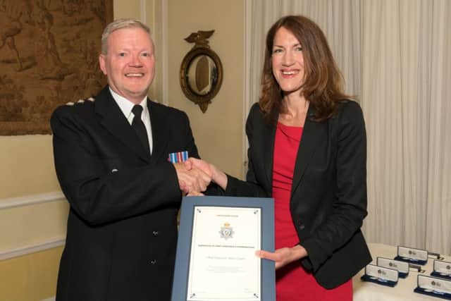 Chief Inspector Jim Tyner with Rachel Watson. EMN-180425-174000001
