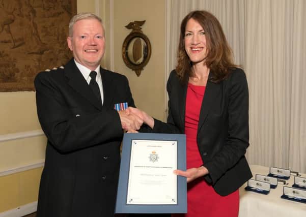 Chief Inspector Jim Tyner with Rachel Watson. EMN-180425-174000001