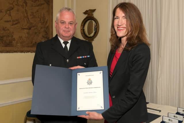 Pc Nick Willey with Rachel Watson. EMN-180425-174230001