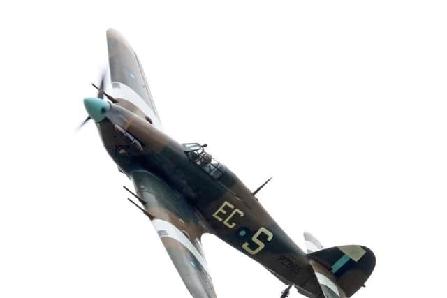 Hurricane PZ865 pilot looks out as he banks left over RAF Coningsby EMN-180426-105042001