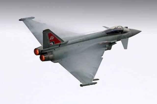 Vapour trails from on the wings of the Typhoon as Flt Lt Jim Peterson practices his 2018 display routine over RAF Coningsby EMN-180426-110813001