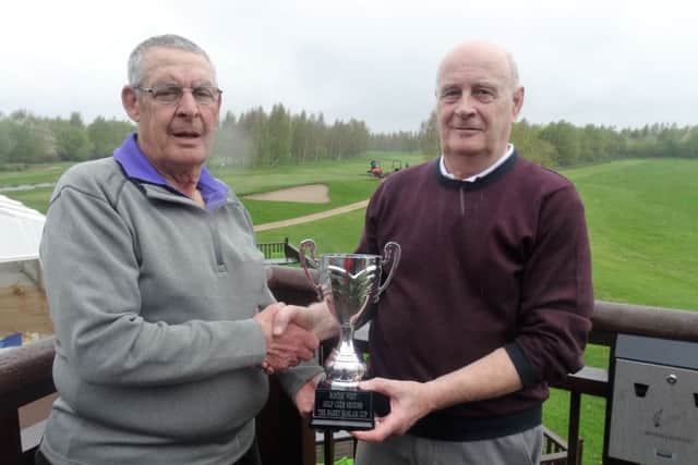 Boston West Seniors Captain Bill Laing presenting Graham Storr with the Barry Haslam Trophy.