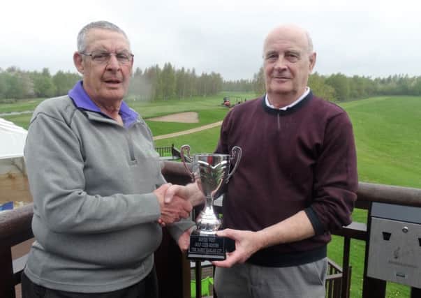 Boston West Seniors Captain Bill Laing presenting Graham Storr with the Barry Haslam Trophy.