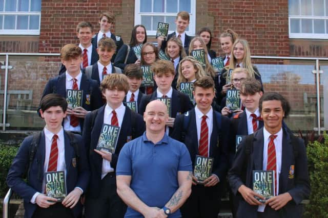 Author Neil Obbard pictured with just some of the Year 11 students he presented books to recently.
