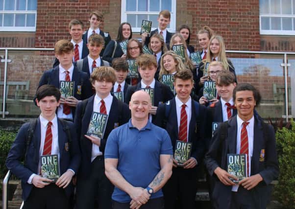 Author Neil Obbard pictured with just some of the Year 11 students he presented books to recently.