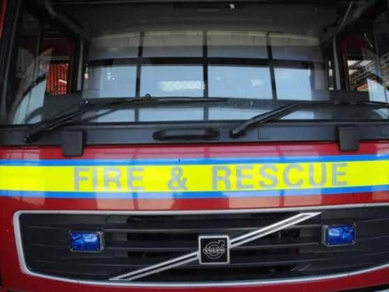 Firefighters freed a woman who was trapped at the scene