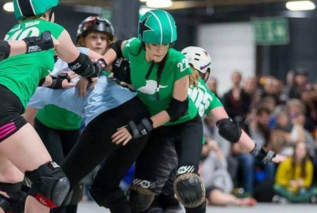 Eve (right) in the thick of the action in the contact sport EMN-180427-150414002