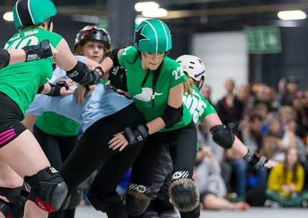 Eve (right) in the thick of the action in the contact sport EMN-180427-150414002