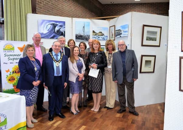 Mayor of North Lincolnshire Coun Peter Clark (third from left) and Mayoress Carol Clark (left) are pictured with members of the Lindsey Lodge Hospice Board of Trustees and artist Dennis Nash (right) at the Art Exhibition and Sale. EMN-180430-171706001