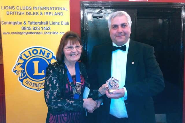 President Pat presents Lion Brian with Tim Barker Memorial Award EMN-180205-122144001