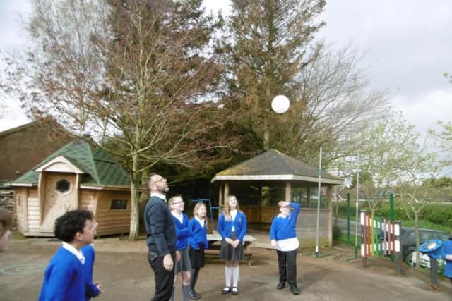 Youngsters look up to the sky during one of many experiments.