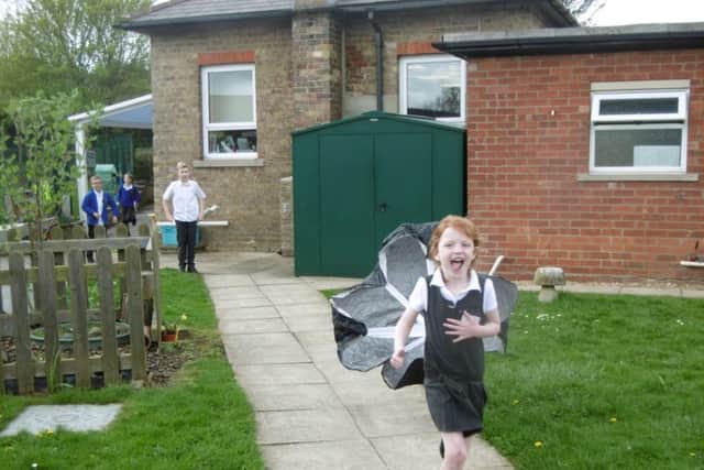 One lucky pupil tries air resistance and streamlining with aeroplanes and parachutes. EMN-180205-141228001