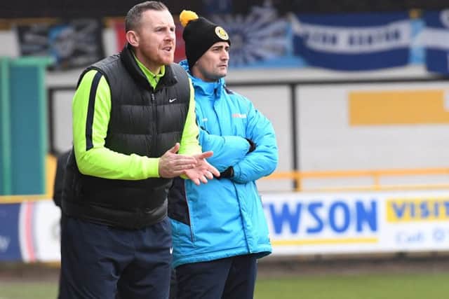 Craig Elliott and assistant Darren Smith.