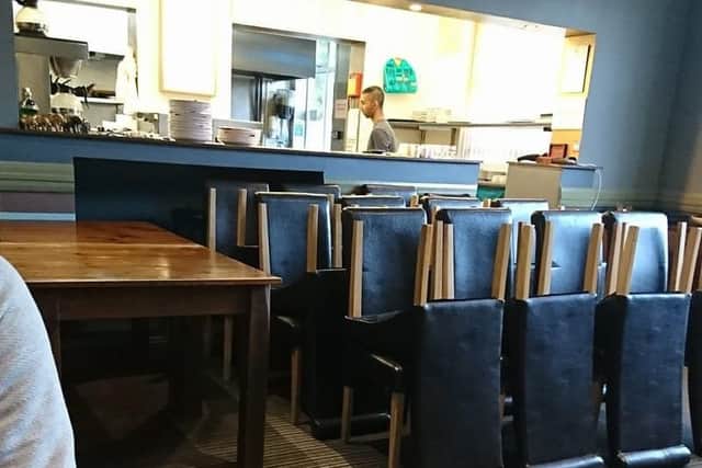 Tables and chairs are packed away by bailiffs as the diners carry on eating. EMN-180305-161153001