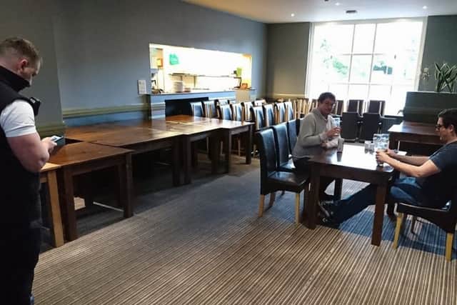 Tables and chairs are packed away by bailiffs as the diners carry on eating. EMN-180305-161204001