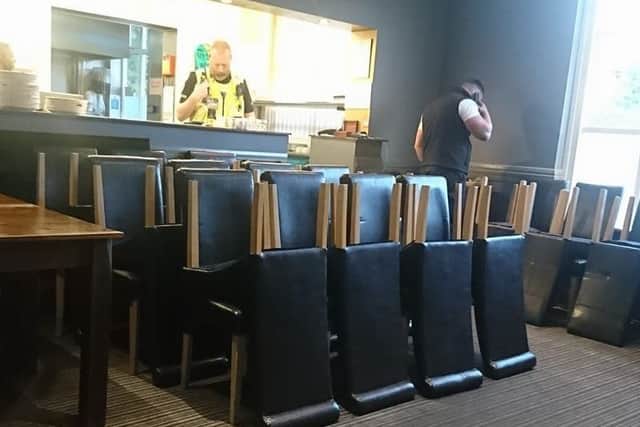 Tables and chairs are packed away by bailiffs as the diners carry on eating. EMN-180305-161215001