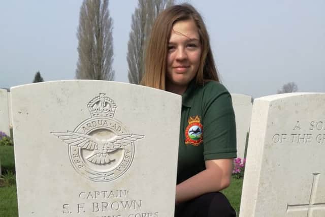 Louth Corporal Grace Whitworth at the grave of Captain Brown.