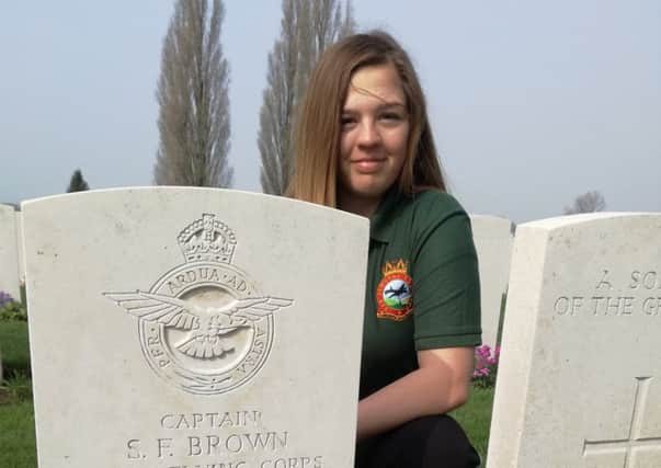 Louth Corporal Grace Whitworth at the grave of Captain Brown.
