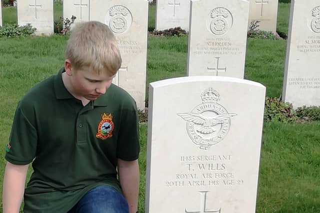 Pictured above is Louth air cadet Lewys Whitfield with the wreath on the grave of Sgt Wills.