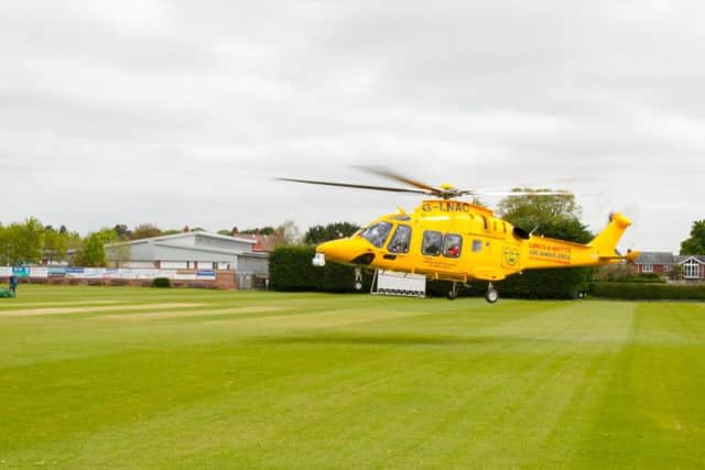 The Lincs and Notts Air Ambulance takes off from Sleaford Cricket Club pitch after a call to assist a pedestrian who was involved in a collision with a car close to the level crossing on Grantham Road. Photo: Mark Suffield.