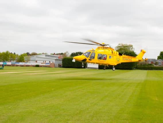 The Lincs and Notts Air Ambulance takes off from Sleaford Cricket Club pitch after a call to assist a pedestrian who was involved in a collision with a car close to the level crossing on Grantham Road. Photo: Mark Suffield.