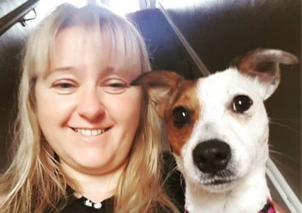 Lisa Hobson is re-united with her beloved four-legged Jack Russell Ellie.